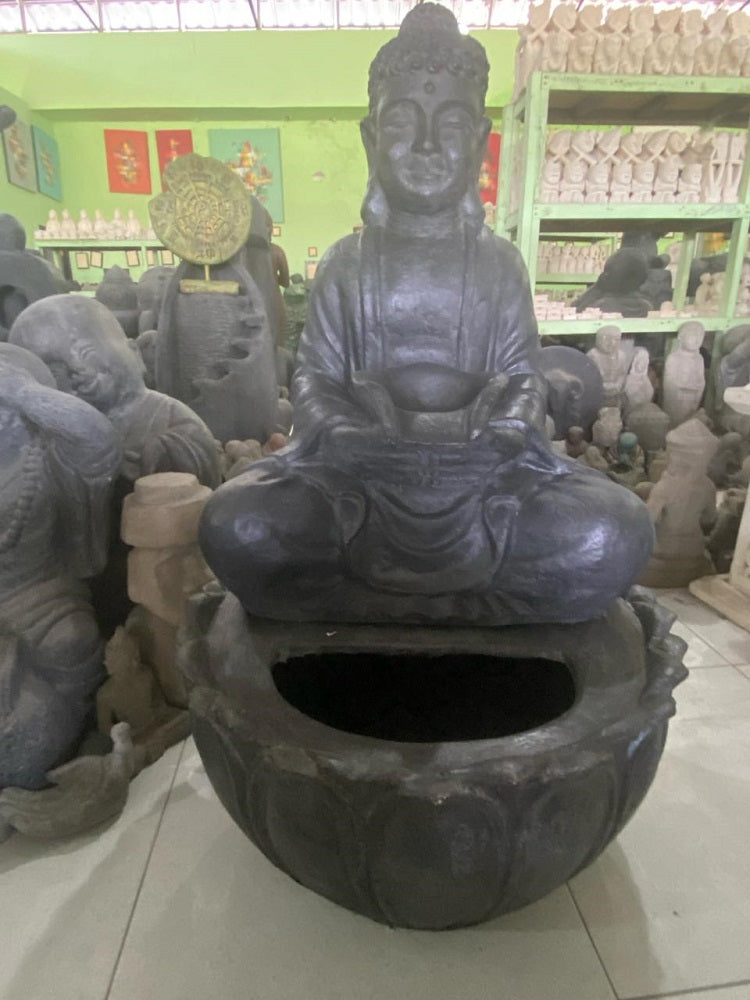 Buddha water feature sitting on bowl